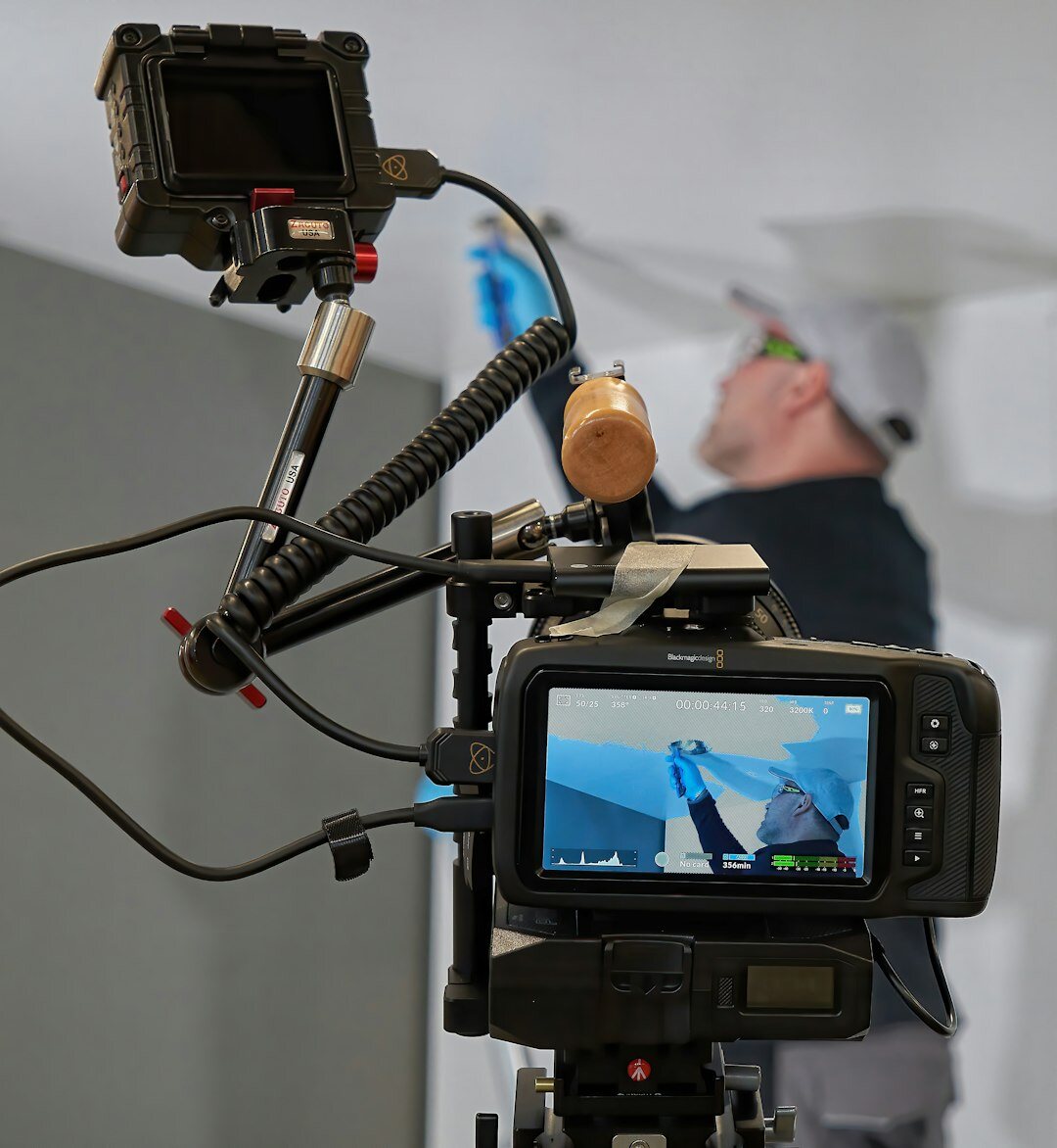 Media professional analysing video interview on monitor