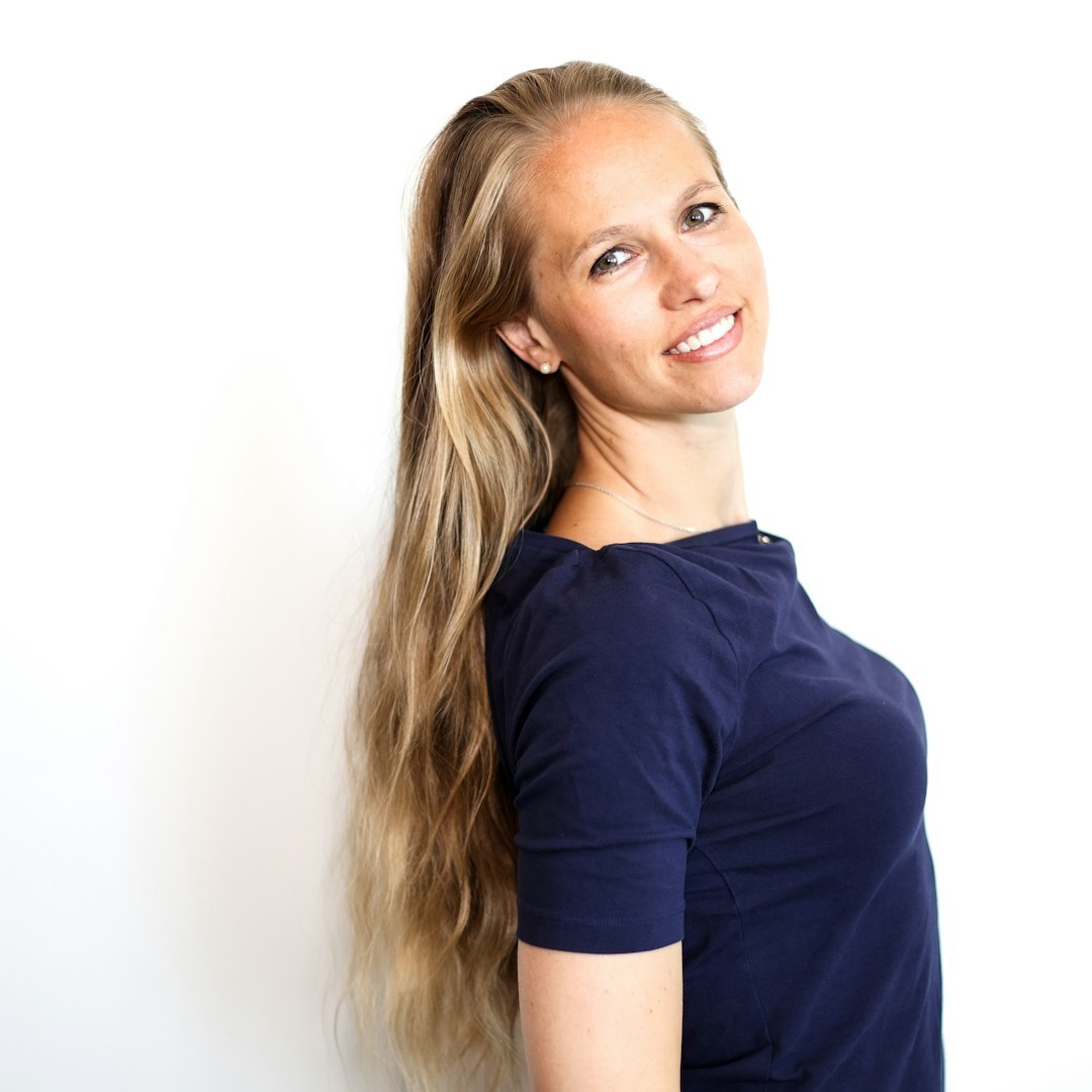 Professional female media trainer smiling in studio